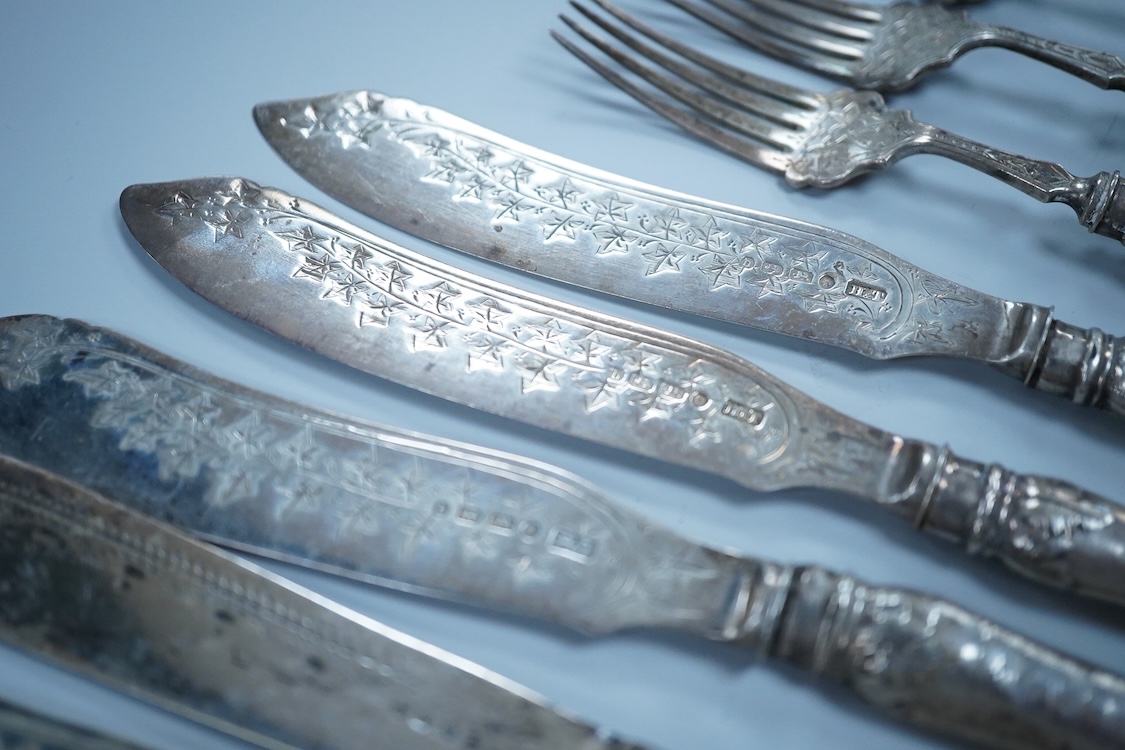Eight Victorian silver fish forks and seven fish knives, by Hilliard & Thomason, Birmingham, 1878, with loaded unmarked white metal handles, one a plated replacement.